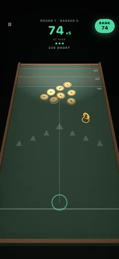Edge: coins clustered by the lip, a pot of 74 at five times, ready to bank.
